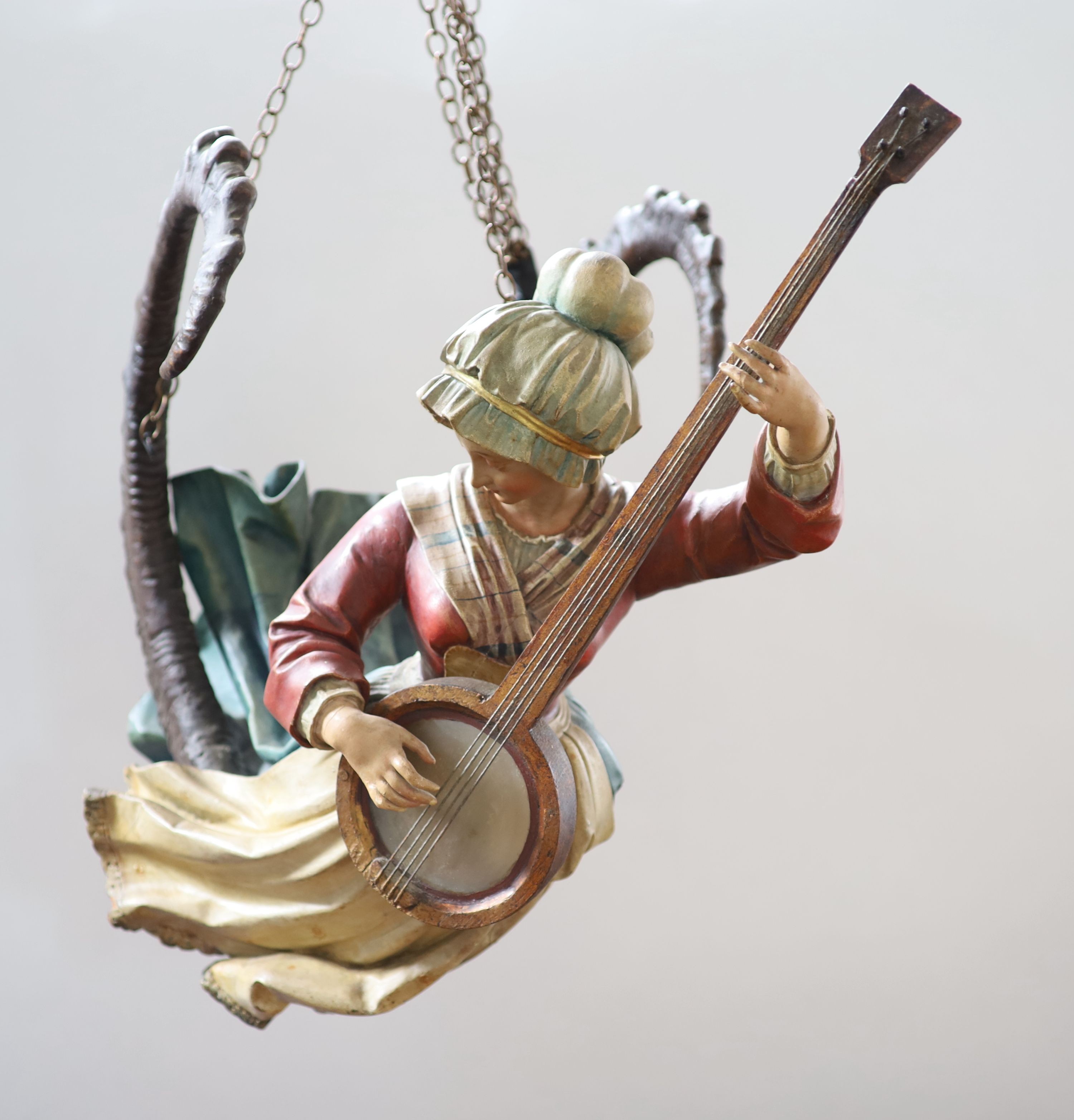 A late 19th century carved and painted wood Lusterweibchen H 60cm. W 80cm.